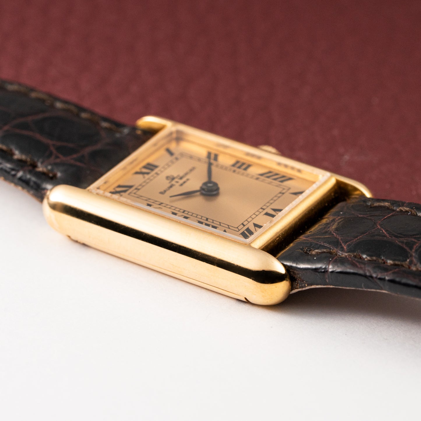 Baume & Mercier Genève Tank Black Roman Numerals 18k Yellow Gold signed by OJ Perrin Paris Ref 38302