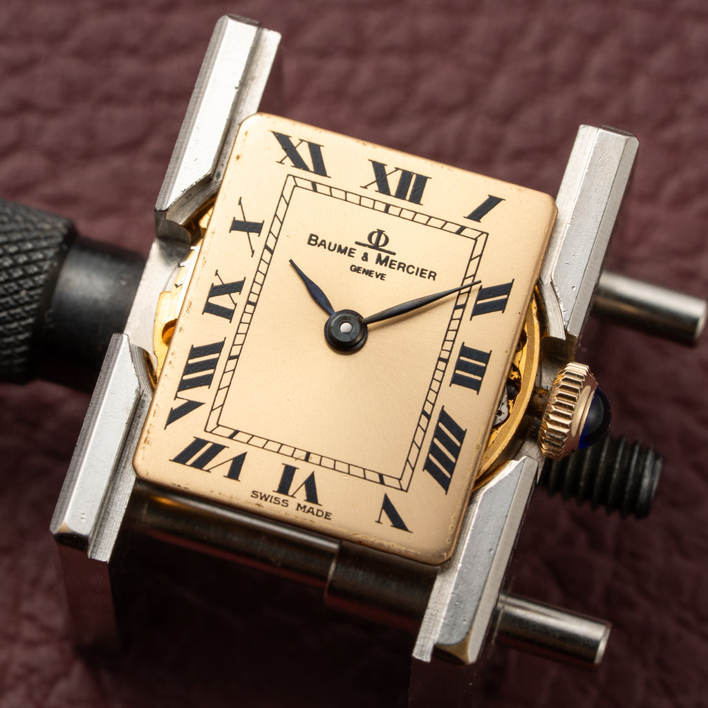 Baume & Mercier Genève Tank Black Roman Numerals 18k Yellow Gold signed by OJ Perrin Paris Ref 38302