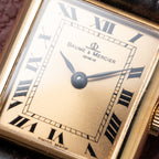 Baume & Mercier Genève Tank Black Roman Numerals 18k Yellow Gold signed by OJ Perrin Paris Ref 38302