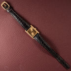 Baume & Mercier Genève Tank Black Roman Numerals 18k Yellow Gold signed by OJ Perrin Paris Ref 38302
