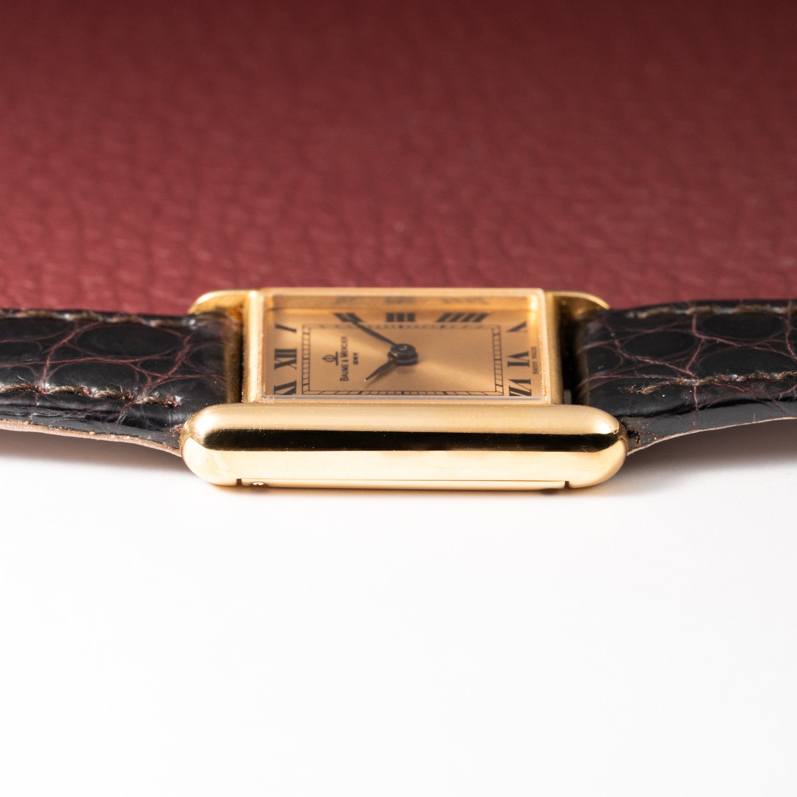 Baume & Mercier Genève Tank Black Roman Numerals 18k Yellow Gold signed by OJ Perrin Paris Ref 38302