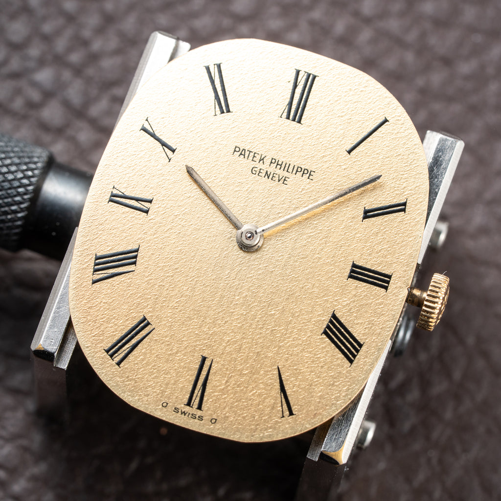 Patek Philippe Ellipse Champagne Textured Roman Dial 18K Yellow Gold Ref 3546 from 1970s